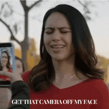 a woman taking a picture of herself with the words get that camera off my face on the bottom