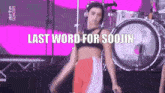 a woman is dancing on a stage with the words last word for soojin written above her