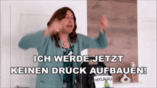 a woman in a green sweater says ich werde jetzt