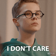 a young boy wearing glasses says i don t care