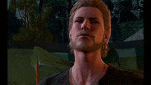 a man with a beard wearing a necklace and earrings