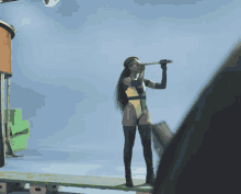 a woman in a bikini is looking through binoculars on a ship