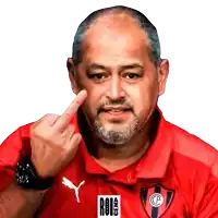 a man with a beard wearing a red shirt that says roi on it