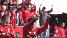 a soccer game is being played in toronto on a kia field