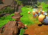 a man in a cowboy hat is playing a video game with a n and e on the screen