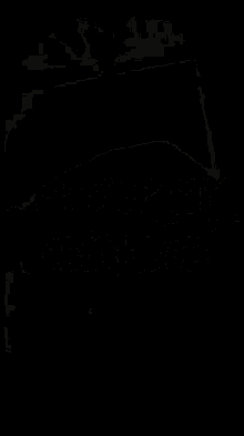 a black and white photo of a light coming out of the corner