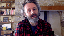 a man with a beard wearing a plaid shirt with the hashtag itsscottiesstark on the bottom
