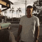 a man wearing a t-shirt that says ' california ' on the front