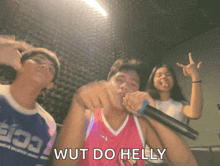 a man singing into a microphone with the words wut do helly on the bottom