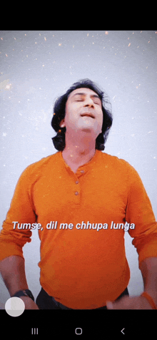 a man wearing an orange shirt with the words tumse dil me chhupa lunga on it