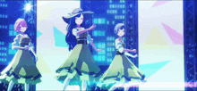 three anime girls are dancing on a stage with buildings in the background