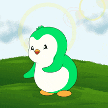 a green and white penguin stands on a grassy hill