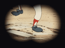 a cartoon drawing of a baseball player 's feet on a dirt field