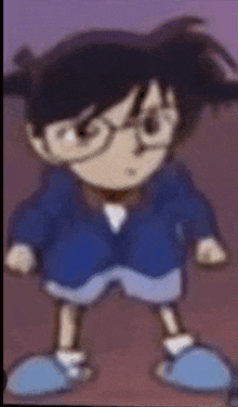 a blurry picture of a boy wearing glasses and a blue jacket .