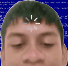 a man 's face is against a blue screen that says a problem has be to your computer