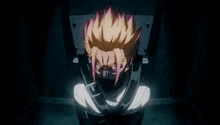 a man with a mask on his face is sitting in a chair with his mouth tied .