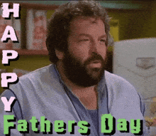 a man with a beard is holding a glass of beer and says happy fathers day