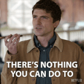 a man speaking into a microphone with the words " there 's nothing you can do to "