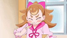 a cartoon girl with a pink bow is holding a cup