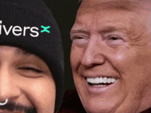 a man wearing a beanie that says ivers x smiles