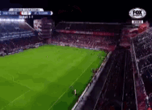 an aerial view of a soccer stadium with a fox logo