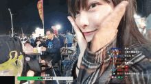 a woman is sitting at a table with a green bar that says $ 2300 on it
