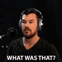 a man wearing headphones and a black shirt is asking what was that