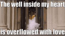 a woman in a wedding dress is standing in front of a door with a quote .