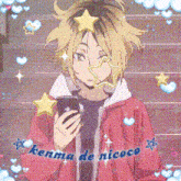 a kenma de nicoco anime character is holding a cell phone in his hand .