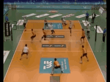a volleyball game is being played on a court with a sign that says ' georgia ' on it