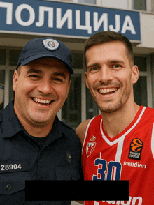 a man wearing a basketball jersey with the number 30 poses with a police officer