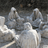 a group of ghosts are sitting in a circle with pixiz written on the bottom right