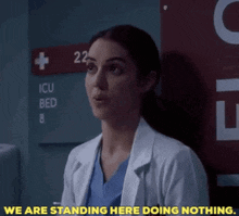 Greys Anatomy Jules Millin GIF - Greys Anatomy Jules Millin We Are Standing Here Doing Nothing GIFs