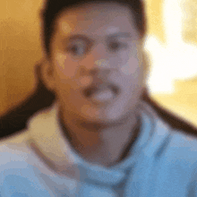 a blurry picture of a man making a face