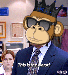 a man in a suit and tie with a monkey mask on his face says this is the worst