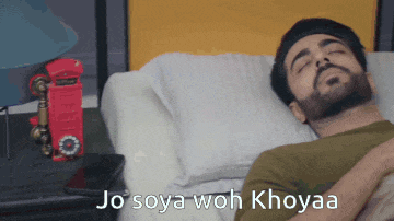 a man laying on a couch with the words 