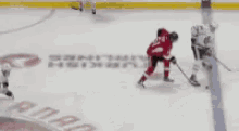 a hockey player in a red jersey with the number 68 on his back
