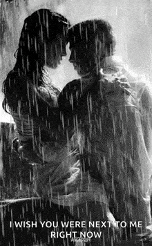 a black and white photo of a man and woman hugging in the rain with the caption `` i wish you were next to me right now '' .