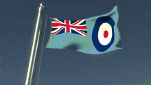 a blue flag with a red white and blue circle on it is flying in the wind
