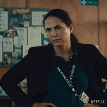 a woman with a lanyard that says state police