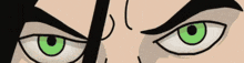 a close up of a cartoon character 's green eye