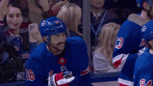 a hockey player wearing a number 16 jersey