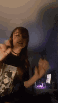 a person in a black t-shirt with a picture of a woman on it