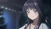 a girl with purple hair and blue eyes looks at the camera