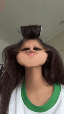 a woman making a face with her hair in a bun