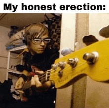 a man playing a bass guitar with the words my honest erection below him