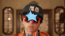 a man wearing sunglasses and a hat with the number 50 on it