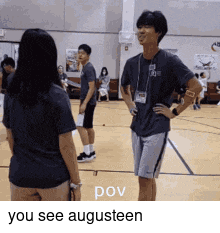 a man and a woman are standing on a basketball court with the words pov you see augusteen below them .