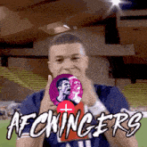 a man giving a thumbs up in front of a sign that says afc kings