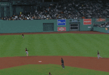 a baseball player wearing a orioles jersey is sitting on the field